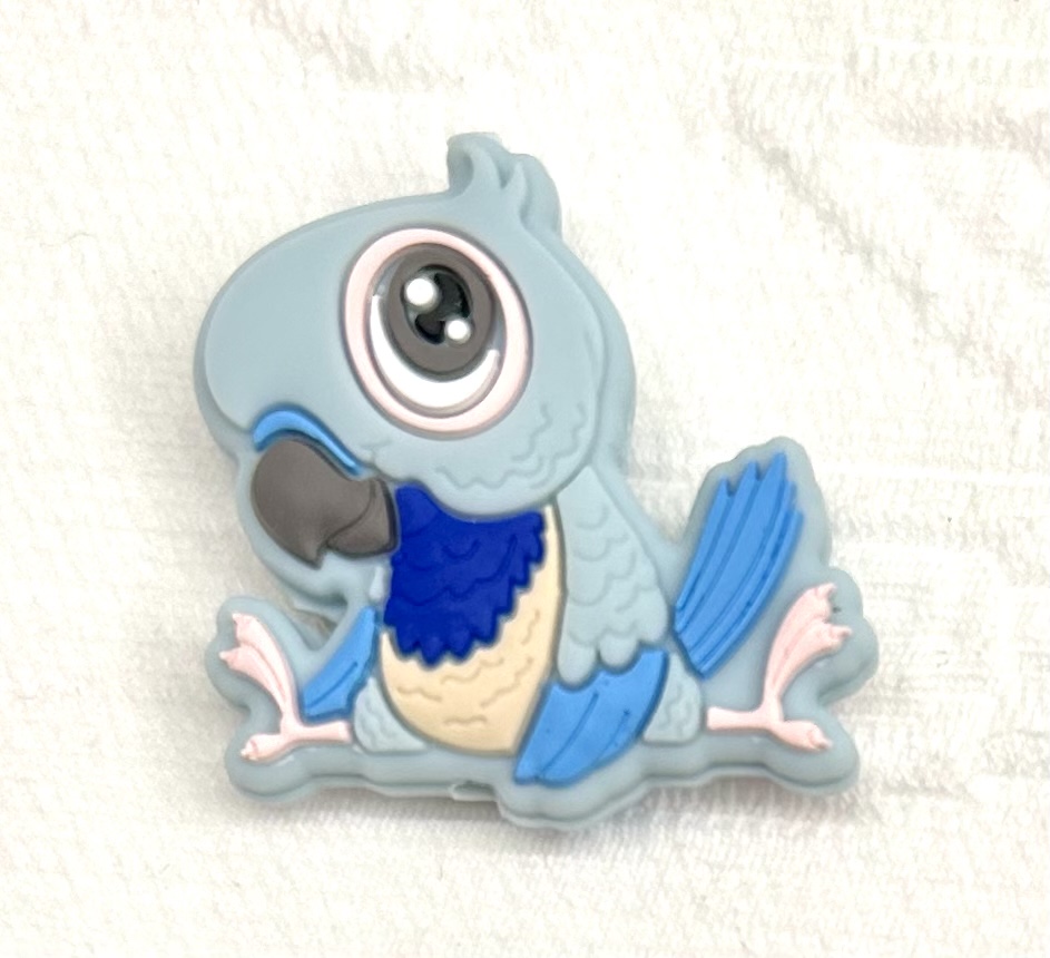 Beissmotiv Papagei babyblau 
