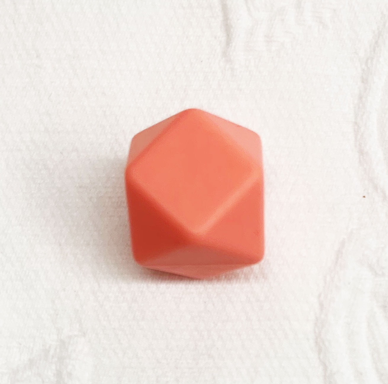 Beissmotiv Diamant Hexagon coral 