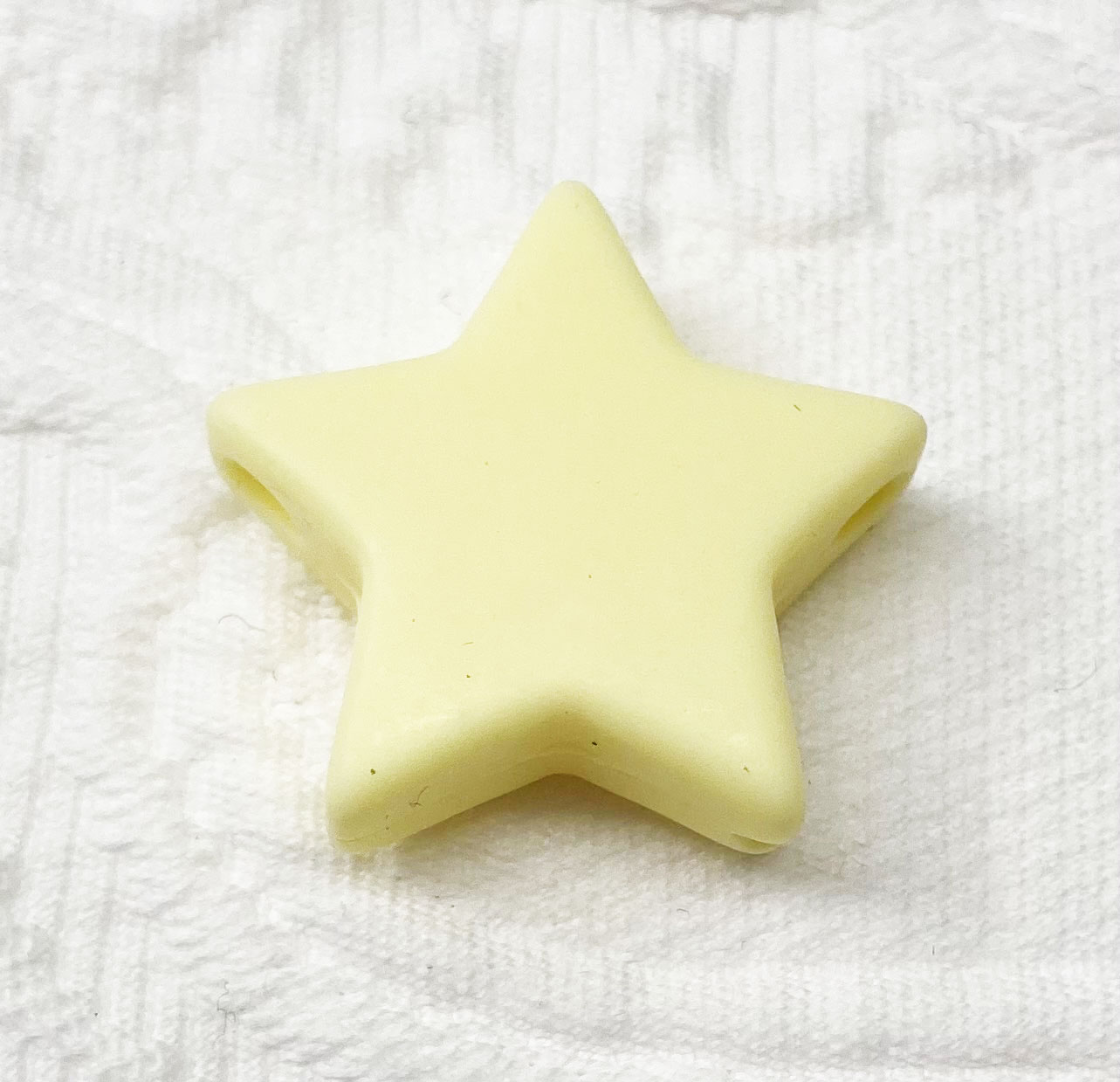 Beissmotiv Sterne mittel pastellgelb 
